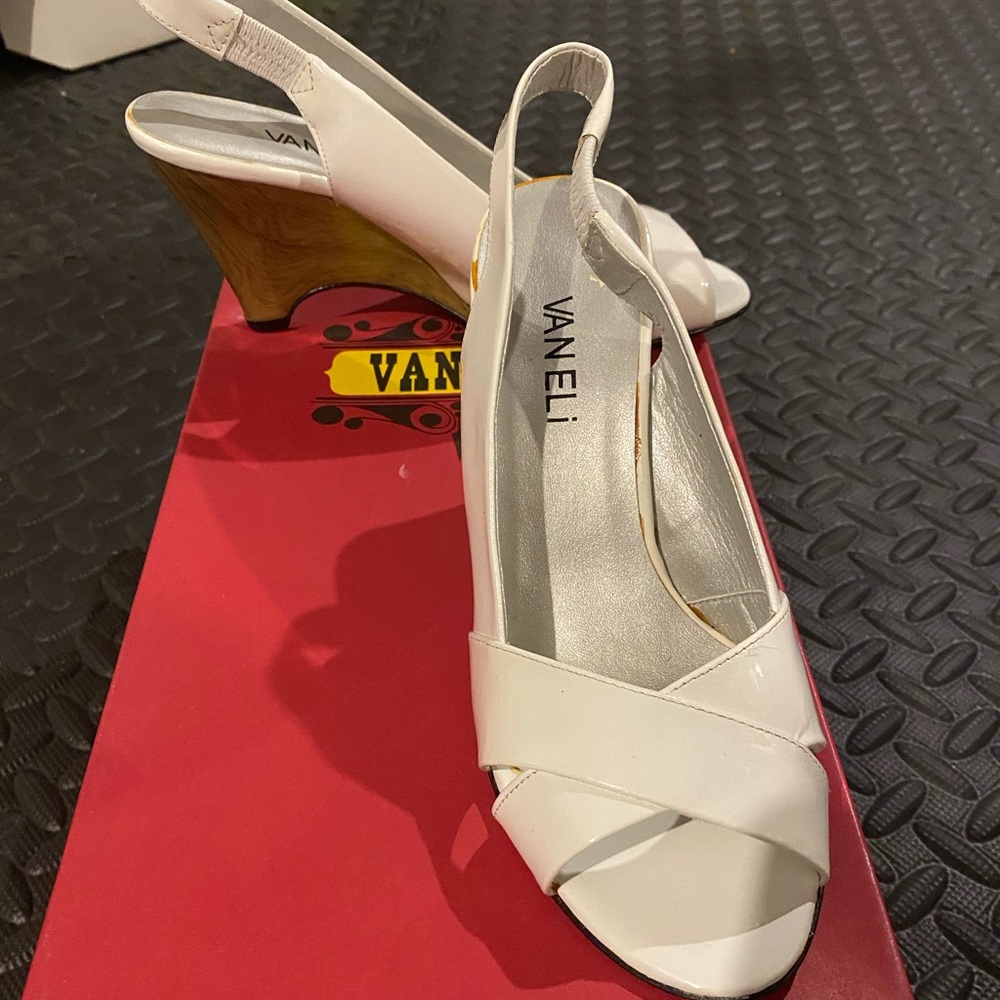 Beautiful white pair of wedge shoes.